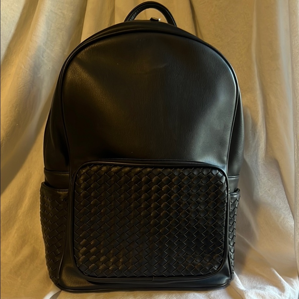 Sleek Black Leather Backpack with Woven Design